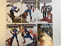 Set of six comic books including 5 Captain America Corps issues and 1 Captain America Rebirth issue, laid out on a flat surface showing front covers.