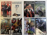 Eight 'Death of Wolverine' comic books showing all covers in mint condition within protective sleeves.