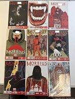 Top-down view of the 9 Morbius comic books arranged in a 3x3 grid showing cover art and overall condition.