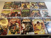 Photo showing 17 individual New Avengers comics laid out in rows, all in protective sleeves, each with colorful Marvel superhero cover art.