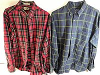 Two men's plaid flannel shirts side by side showing colors and patterns