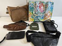 Photo showing all seven bags and pouches together on a white surface.