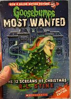 Cover of the Goosebumps Most Wanted Special Edition book showing title, author, and artwork of a spooky Christmas character in front of a haunted house with Christmas lights.