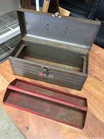 Open gray metal Craftsman toolbox showing interior and removable red tray