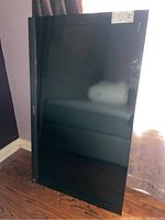 Front angled view of Sony Bravia television showing large black screen and bottom bezel with Sony logo.