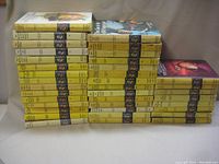 Two wide stacks of yellow-spined Nancy Drew hardcovers arranged side by side