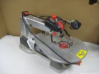 Side view of the Craftsman scroll saw showing the metal body, power cord, and base.