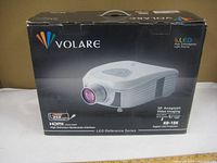 Original product box displaying Volare digital LED projector model ND-18K with branding, product photo, and features like USB and HDMI ports.