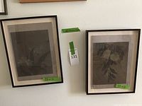 Two framed fabric art pieces hanging on a wall, each labeled 12x16 in size.