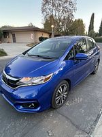 Exterior front three-quarter view on driveway