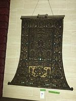 Full front view of scroll art hanging on wall