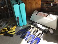 Overview of all items including folded kayak panels, storage box, paddle, mesh bag, life jacket and snorkeling fins