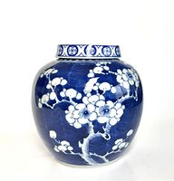 Front view of jar showcasing plum blossom decoration and overall shape