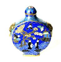 Front view of the antique/vintage Chinese cloisonné snuff bottle showing detailed enamel artwork and brass animal head fittings on the sides.