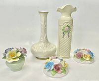 Five porcelain items: two vases and three floral candy holders arranged on white background.