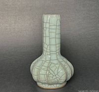 Front view of the garlic head shaped ceramic bottle with Guan crackle glaze