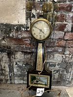 Full view of the vintage Elm City Electric decorative wall clock with painted wooden case and lower scenic panel.