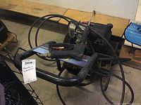 Overall view showing frame, hoses, and spray gun