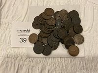 Full overview of the lot showing stacked and scattered tokens on white background