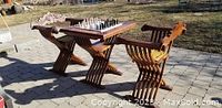 Table assembled with two chairs and chess set in outdoor setting