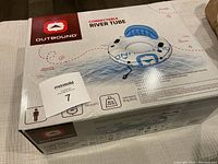 Box of Outbound Connectable River Tube showing front side with product image and brand logo.
