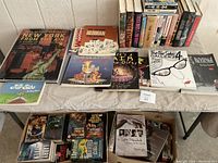 Image showing a spread of various books including New York architecture, Far Side collections, and Stephen King novels