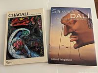 Two art books, one on Marc Chagall and the other on Salvador Dali, shown closed to display covers.