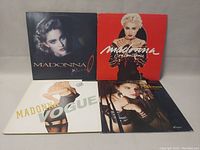 Front view of 4 Madonna vinyl record covers showing portraits and artistic album artwork.