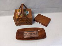 Photo showing all three wooden items: sewing box, wood box, and tray on a white surface.