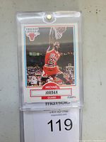 Front side of 1990 Fleer Michael Jordan basketball card showing Jordan dunking in Chicago Bulls jersey