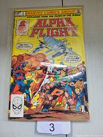 Front cover of Alpha Flight #1 comic book showing main characters and title with some signs of wear, protected in plastic sleeve.