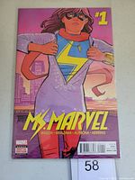 Front cover of Ms. Marvel #1 comic book featuring Ms. Marvel superhero character in costume against cityscape background.