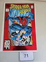 Front cover of Spider-Man 2099 #1 comic book showing Spider-Man in blue and red suit jumping from a futuristic city background.