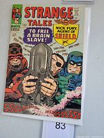 Front cover of Strange Tales #143 comic book showing Nick Fury and other comic characters, with title and price detail.
