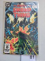 Front cover of The Saga of Swamp Thing #20 comic book showing vibrant colors and superhero in action scene.
