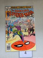 Front cover of The Amazing Spider-Man #177 comic book showing Spider-Man and Green Goblin in action with colorful graphics and text.