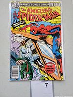 Front cover of The Amazing Spider-Man #189 comic book showing Spider-Man and another character in bandages, with comic title and pricing details.