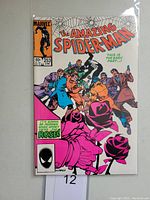 Front cover of The Amazing Spider-Man #253 comic showing cover art with Spider-Man and other characters.