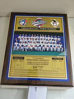 Front view of the full plaque showing team photo, World Series logo, and text details