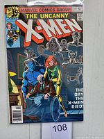 Front cover of The Uncanny X-Men issue #114 with main visual of X-Men characters and pricing info