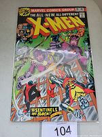 Front cover of Uncanny X-Men #98 comic book showing colorful artwork of X-Men characters and Sentinels with issue number and price visible.