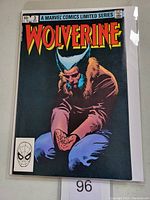 Front cover showing Wolverine crouched with hands extended wearing a fur-collared jacket and jeans under 'WOLVERINE' title banner.