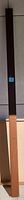 Single brown post sleeve standing vertically against a tiled floor background, showing its full length, rectangular cross-section, and color.