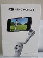 Front of DJI Osmo Mobile 6 box showing the stabilizer holding a smartphone and DJI branding.