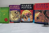 Front view of all four books together, showing spines and front covers for identification and condition.