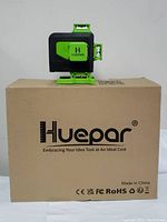 Huepar S03CG unit resting on top of its original cardboard box