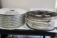 Two large reels of rolled LED RGB light strips on spools, showing overall size and condition.