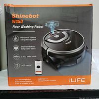 Front of original ILIFE Shinebot W450 box showing model name, floor washing robot label, PanoView camera navigation system, separated water tanks, roller brush and app control icons