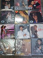 Photo showing 12 record albums featuring R&B and jazz artists, original inserts visible, in protective sleeves.