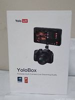 Front of retail box showing YoloLiv branding, product image and model name